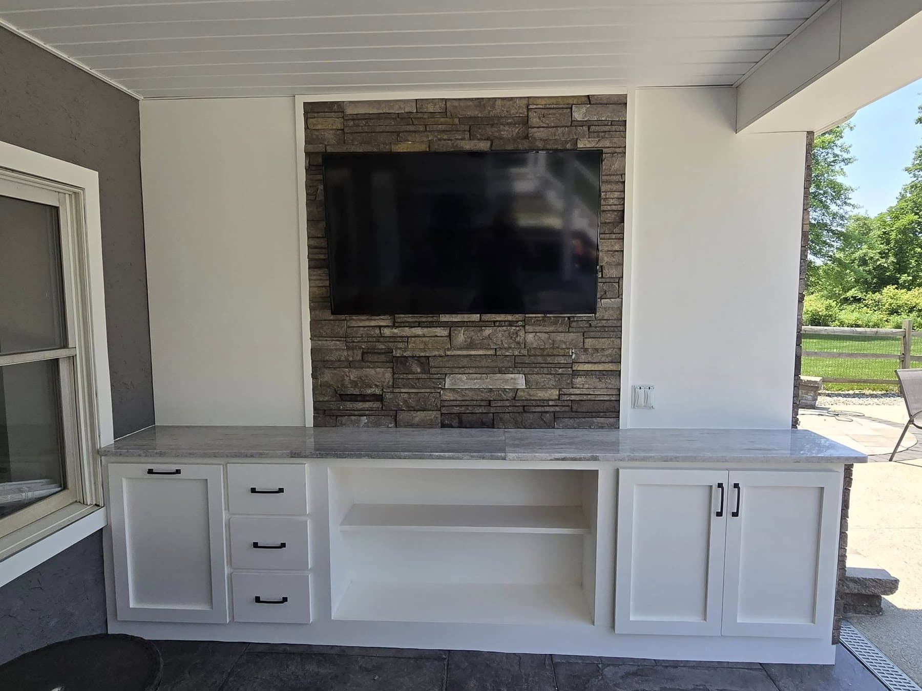 Outdoor TV and fireplace feature in Doylestown