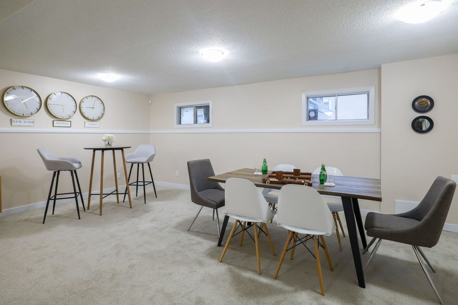 Basement remodeling near you: finished dining and game area with carpet and recessed lighting